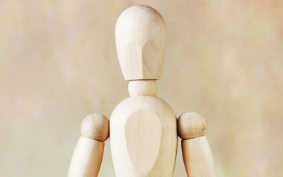 What Is Man? photo of wooden figure representing man